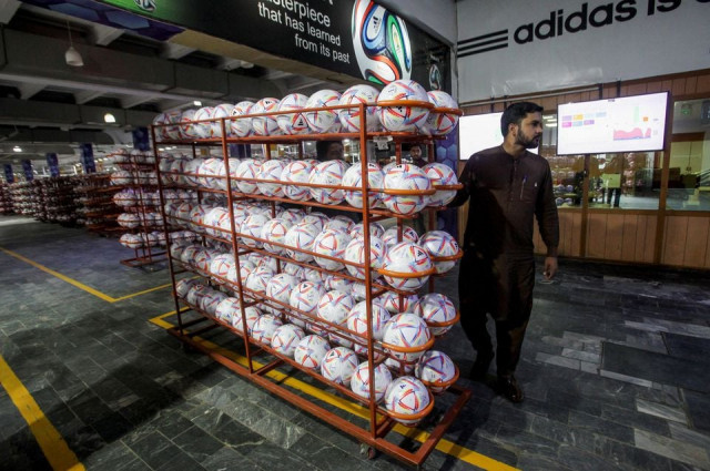 a worker moves a lot of finished balls out of the production area inside the soccer ball factory in sialkot pakistan november 30 2022 photo reuters a worker moves a lot of finished balls out of the production area inside the soccer ball factory in sialkot pakistan november 30 2022 photo reuters