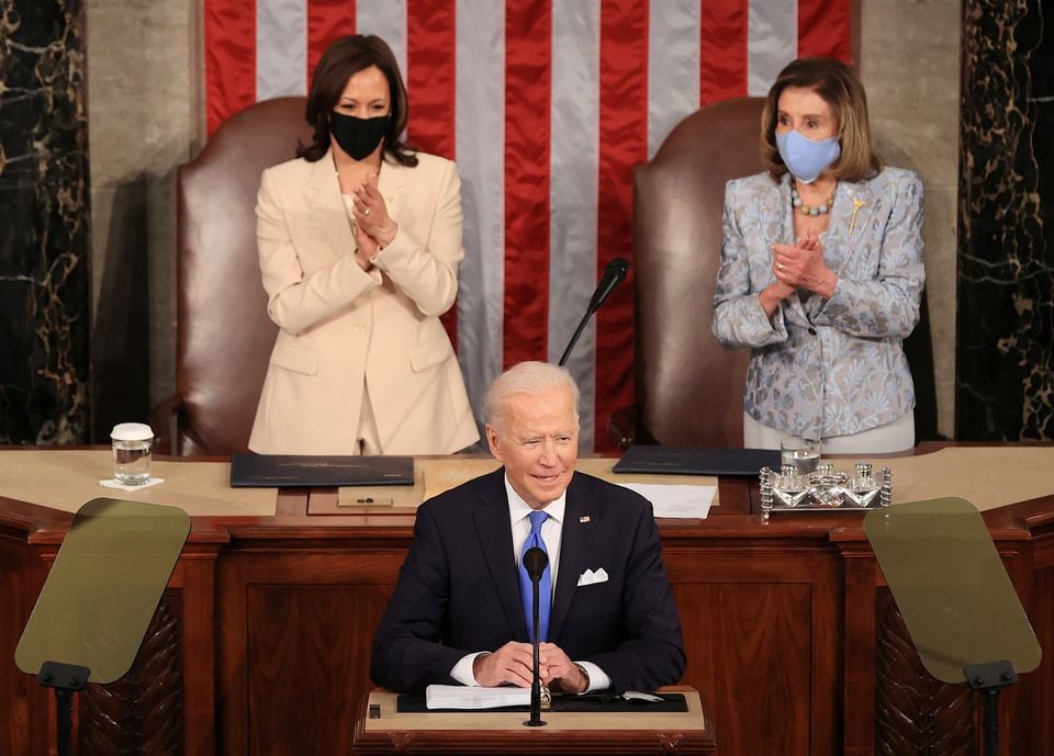 u s president joe biden addresses a joint session of congress as president kamala harris and speaker of the house u s rep nancy pelosi d ca react in the u s capitol in washington dc u s april 28 2021 reuters