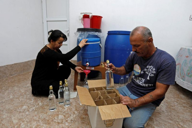 yazidi iraqi keeps tradition alive of arak making from dates yazidi iraqi keeps tradition alive of arak making from dates