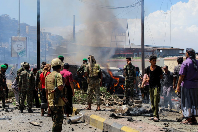 policemen and people gather at the scene of a blast in aden yemen october 10 2021 photo reuters policemen and people gather at the scene of a blast in aden yemen october 10 2021 photo reuters