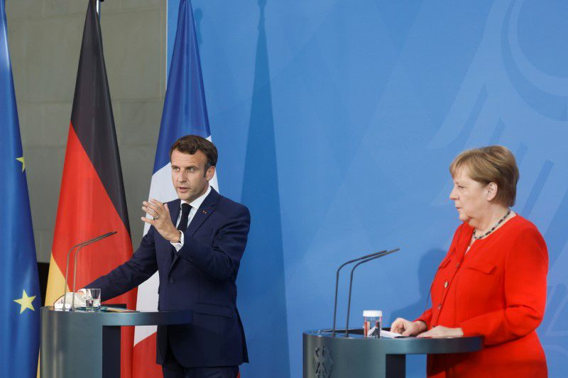 french president emmanuel macron speaks as he and german chancellor angela merkel give a news statement in berlin germany june 18 2021 photo reuters