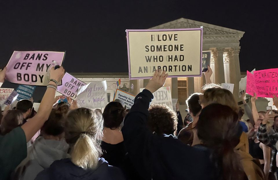 protestors react outside the u s supreme court to the leak of a draft majority opinion written by justice samuel alito preparing for a majority of the court to overturn the landmark roe v wade abortion rights decision later this year in washington u s may 2 2022 reuters