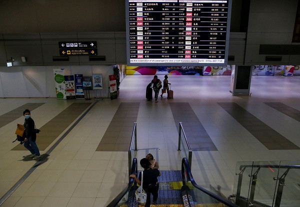 travellers walk at don mueang international airport as the country reopens its borders to vaccinated tourists in chiang mai thailand november 23 2021 picture taken november 23 2021 photo reuters