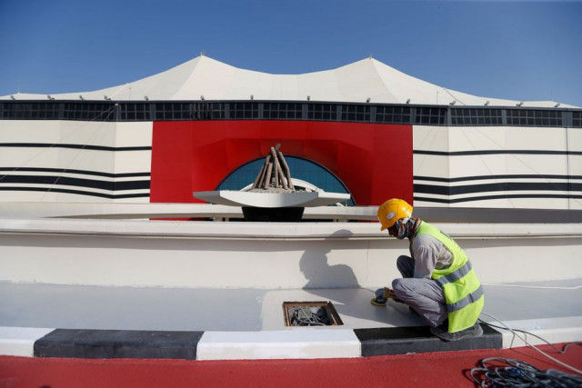 a worker puts final touches at al bayt stadium one of the venues of the qatar world cup 2022 in al khor qatar november 17 2021 photo reuters a worker puts final touches at al bayt stadium one of the venues of the qatar world cup 2022 in al khor qatar november 17 2021 photo reuters