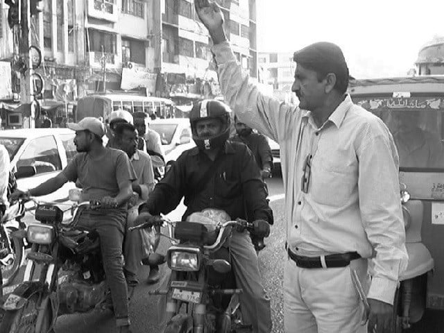 zareen khan controls traffic as a volunteer with traffic police in the saddar area of karachi photo express