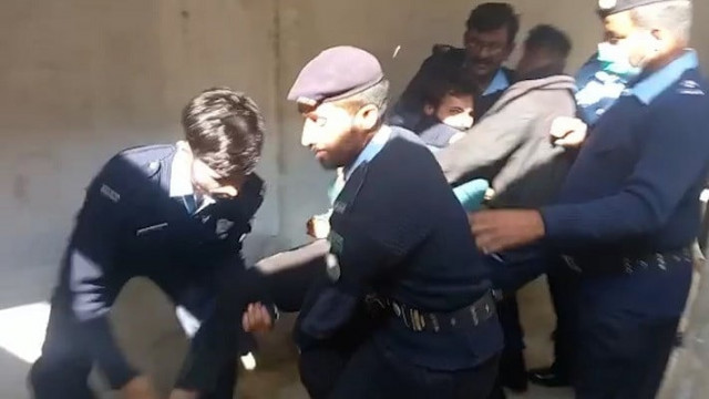 police officers try to hold zahir jaffer as he throws himself about on being escorted out of the court on judge ata rabbani s orders photo express file police officers try to hold zahir jaffer as he throws himself about on being escorted out of the court on judge ata rabbani s orders photo express file