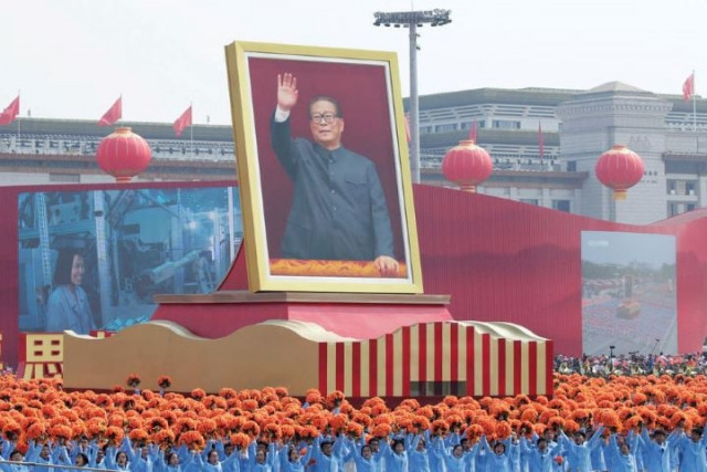 performers travel past tiananmen square next to a float showing former chinese president jiang zemin during the parade marking the 70th founding anniversary of people s republic of china on its national day in beijing china october 1 2019 photo reuters performers travel past tiananmen square next to a float showing former chinese president jiang zemin during the parade marking the 70th founding anniversary of people s republic of china on its national day in beijing china october 1 2019 photo reuters