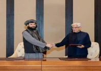 defence minister khawaja muhammad asif and afghan defence minister mullah mohammad yaqoob mujahid shake hands following the signing of a ceasefire agreement mediated by qatar and turkey in doha on october 19 photo reuters