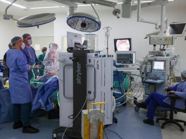 ricardo funke chief of surgery at clinica las condes uses an autonomous artificial intelligence guided camera and mars magnetic assisted robotic surgery robots while performing a gallbladder removal alone in santiago chile september 8 2025 photo reuters