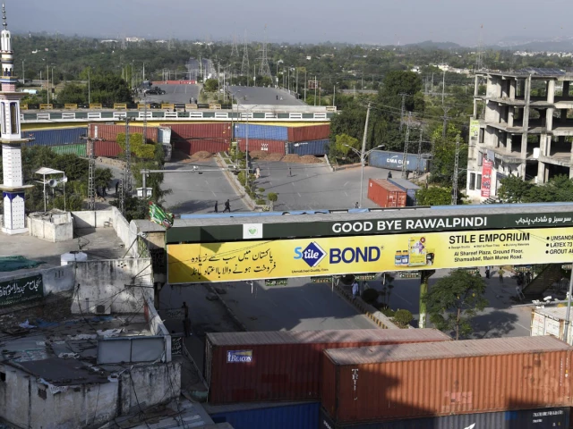 a view of containers placed at faizabad as authorities ramped up security in the federal capital and adjoining rawalpindi on friday following the tehreek e labbaik pakistan s tlp call for a gaza march photo inp a view of containers placed at faizabad as authorities ramped up security in the federal capital and adjoining rawalpindi on friday following the tehreek e labbaik pakistan s tlp call for a gaza march photo inp