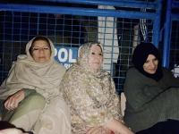 sisters of pti founder imran khan sit outside adiala jail after a meeting was denied on tuesday photo x pti