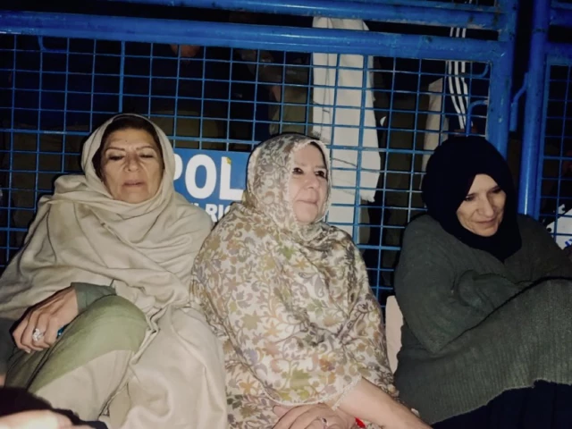 sisters of pti founder imran khan sit outside adiala jail after a meeting was denied on tuesday photo x pti sisters of pti founder imran khan sit outside adiala jail after a meeting was denied on tuesday photo x pti