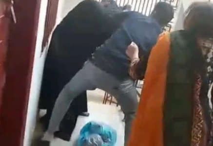 screengrab from a video showing a man brutally assaulting a domestic worker in karachi s buffer zone