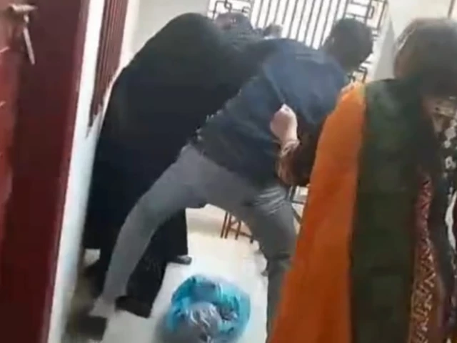 screengrab from a video showing a man brutally assaulting a domestic worker in karachi s buffer zone screengrab from a video showing a man brutally assaulting a domestic worker in karachi s buffer zone