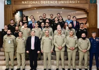 chief of defence forces field marshal asim munir poses for group photograph with faculty and staff of the national defence university during his visit to the institution in islamabad on tuesday photo ispr