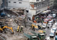 rescue workers and heavy machinery continue debris removal at gul plaza on m a jinnah road following a devastating fire as authorities fear the death toll may rise further photo ppi