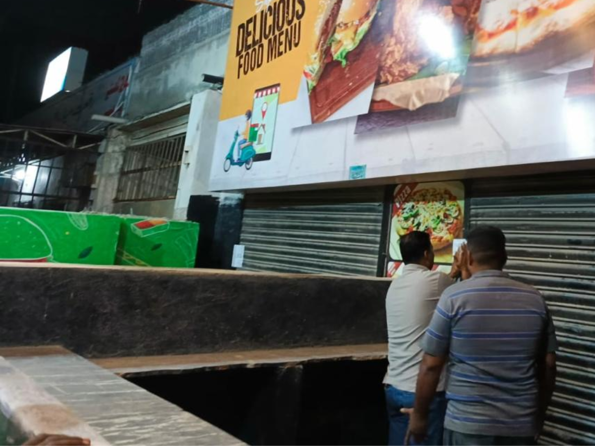 Authorities sealing a restaurant during a crackdown on roadside encroachment in Karachi. Photo: Handout