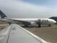 pakistan international airlines pia passenger plane sits on tarmac as seen through a plane window at the islamabad international airport islamabad pakistan october 27 2024 photo reuters file