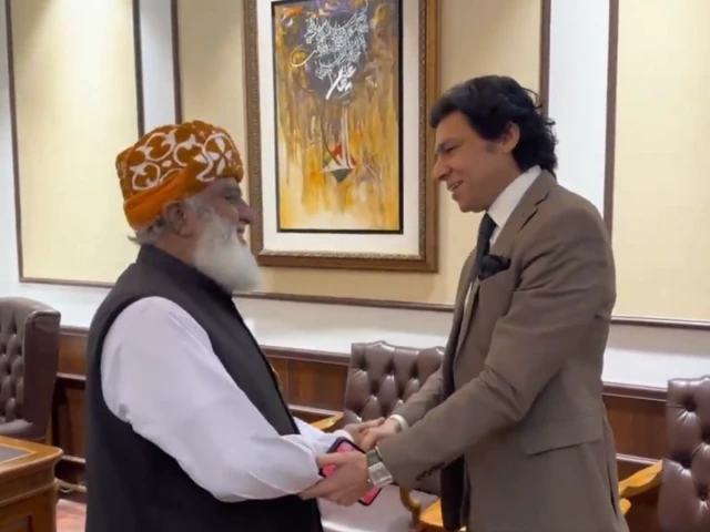 senator faisal vawda shakes hands with jamiat ulema i islam jui f chief maulana fazl ur rehman after a meeting at the latter s residence in islamabad on wednesday screengrab