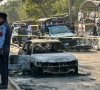 policemen examine damaged vehicles after a suicide blast outside the district court in islamabad on november 11 2025 photo afp