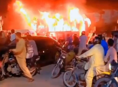 coach set ablaze after man killed in korangi road accident coach set ablaze after man killed in korangi road accident