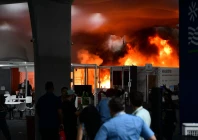 a fire burns in a pavilion during the cop30 un climate change conference in belem para state brazil on november 20 2025 a fire erupted at a pavilion inside the venue of the un s climate talks in brazil on thursday prompting panicked delegates to run for the exits afp journalists said emergency crews rushed to try to put out the blaze as smoke engulfed the corridor photo afp