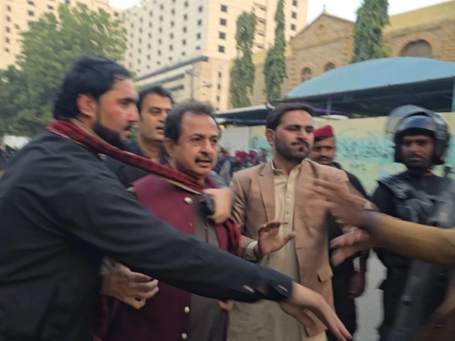 police personnel take pti sindh president haleem adil sheikh into custody outside the karachi press club on friday nov 28 2025 photo express police personnel take pti sindh president haleem adil sheikh into custody outside the karachi press club on friday nov 28 2025 photo express