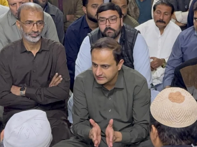 karachi mayor murtaza wahab speaks with relatives of three year old ibrahim who fell into a manhole in karachi during a visit to the boy s home photo express