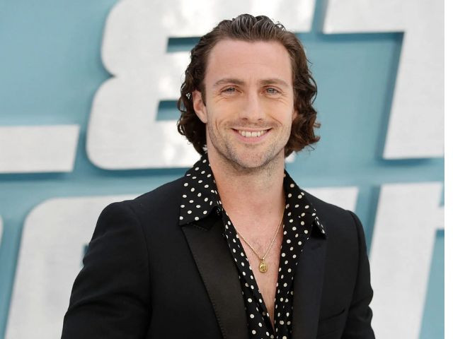 aaron taylor johnson makes a statement in black tuxedo at battleground premiere in venice