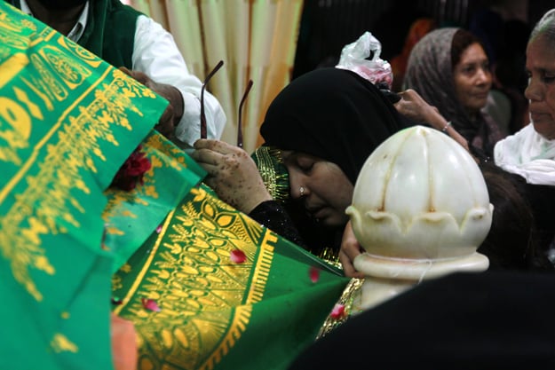 Visiting the grave is a spiritual experience for the devotees of Abdullah Shah Ghazi. PHOTO: ATHAR KHAN