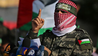 abu ubaida the spokesman of the izz el deen al qassam brigades gestures as he speaks during an anti israel military show in the southern gaza strip november 11 2019 photo reuters