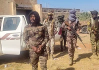 this handout picture released by the sudanese rapid support forces rsf on october 30 2025 shows rsf members reportedly detaining a fighter known as abu lulu l in el fasher in war torn sudan s western darfur region    rapid support forces rsf afp