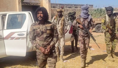 this handout picture released by the sudanese rapid support forces rsf on october 30 2025 shows rsf members reportedly detaining a fighter known as abu lulu l in el fasher in war torn sudan s western darfur region    rapid support forces rsf afp
