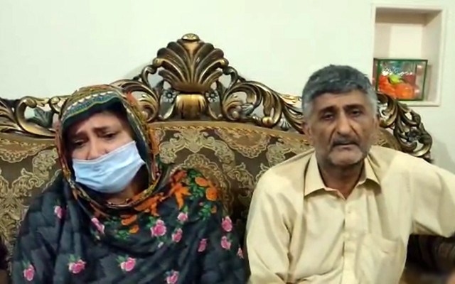 the parents of dr abuzar muhammad afzal pleading for the release of their son in a video screengrab