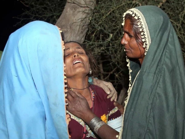 relatives of victims weep after a road accident near thana bula khan in jamshoro on tuesday april 22 2025 at least 13 people were killed and 20 others injured in a road accident in pakistan s southern sindh province on monday night local authorities confirmed on tuesday the incident occurred in the jamshoro district where a passenger van carrying more than 30 people veered off the road and plunged into a ravine according to local police sources sajjad zaidi ppi images relatives of victims weep after a road accident near thana bula khan in jamshoro on tuesday april 22 2025 at least 13 people were killed and 20 others injured in a road accident in pakistan s southern sindh province on monday night local authorities confirmed on tuesday the incident occurred in the jamshoro district where a passenger van carrying more than 30 people veered off the road and plunged into a ravine according to local police sources sajjad zaidi ppi images