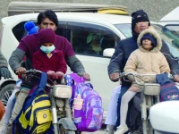 wind chill factor hits children on bikes