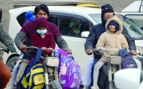 wind chill factor hits children on bikes