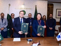 secretary economic affairs division muhammad humair karim and asian development bank country director emma fan display signed documents following an agreement ceremony between pakistan and adb on december 25 photo pid