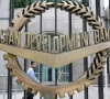 a worker walks past inside the asian development bank adb headquarters in manila june 17 2009 reuters