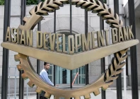 a worker walks past inside the asian development bank adb headquarters in manila june 17 2009 reuters