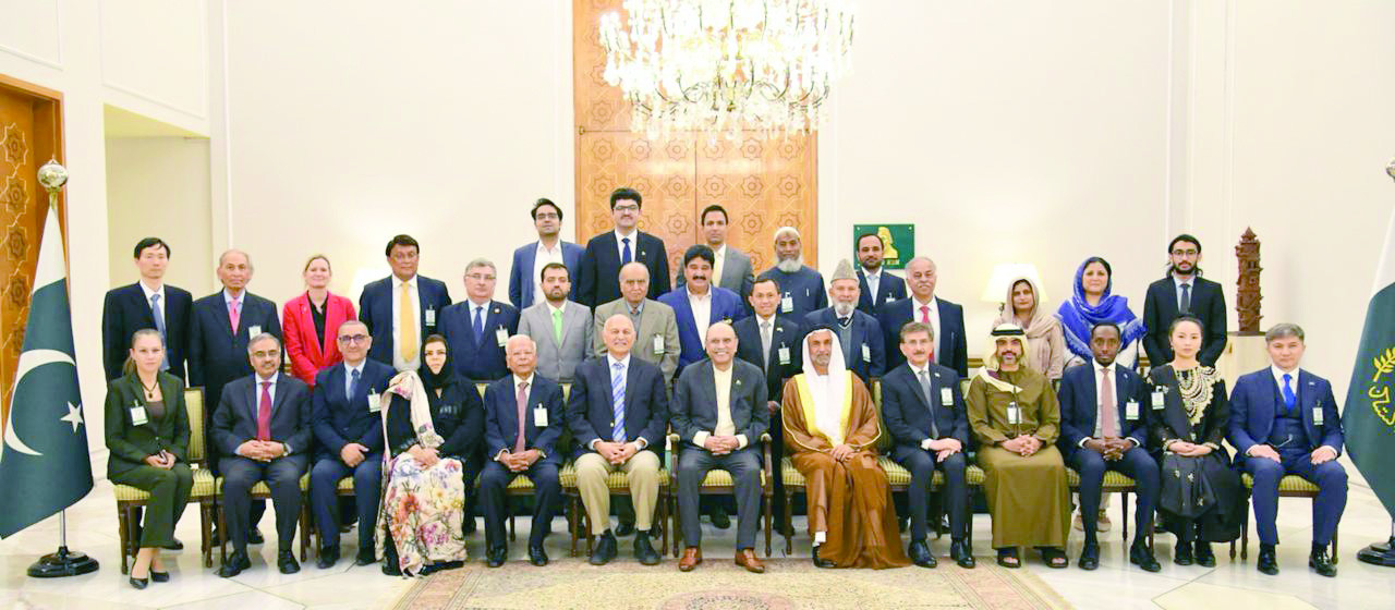 president asif ali zardari smiles for a group photo at the conclusion of an international conference in islamabad photo express