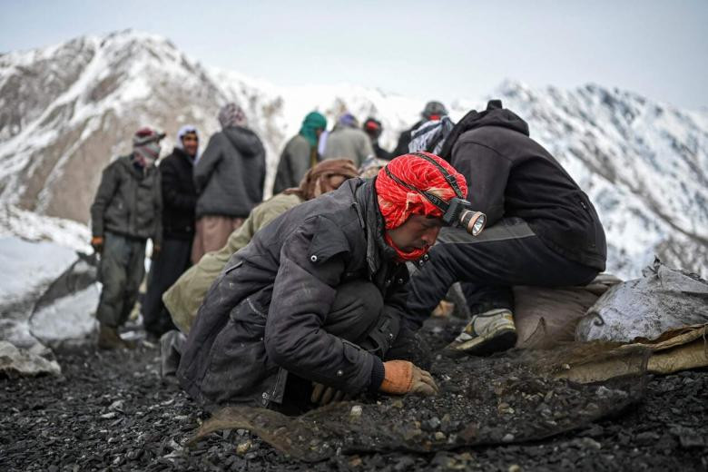 a man searches for emeralds near the mining area on a mountain in the mikeni valley in panjshir afghanistan on jan 12 2022 photo afp