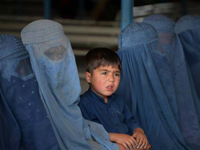 afghan refugee families wait to be registered at the unhcr repatriation centre photo afp afghan refugee families wait to be registered at the unhcr repatriation centre photo afp