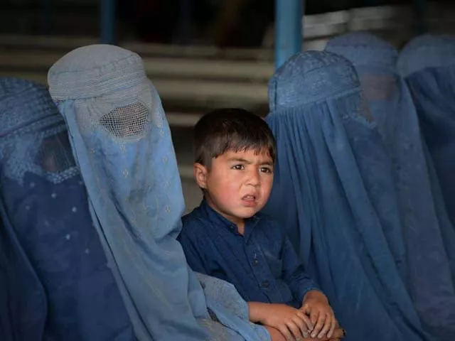 afghan refugee families wait to be registered at the unhcr repatriation centre photo afp afghan refugee families wait to be registered at the unhcr repatriation centre photo afp
