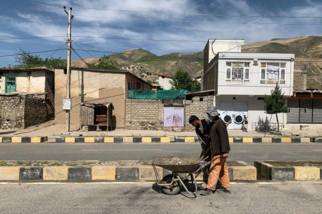 afghan municipal workers clean the site of a sticky bomb that detonated next to a security convoy in fayzabad of badakhshan province on may 8 2024 three policemen were killed and five were wounded on may 8 when a sticky bomb was detonated next to a security convoy tasked with clearing illegal poppy crops in northeastern afghanistan the interior ministry said photo by omer abrar afp afghan municipal workers clean the site of a sticky bomb that detonated next to a security convoy in fayzabad of badakhshan province on may 8 2024 three policemen were killed and five were wounded on may 8 when a sticky bomb was detonated next to a security convoy tasked with clearing illegal poppy crops in northeastern afghanistan the interior ministry said photo by omer abrar afp