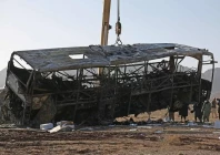 the wreckage of a bus is towed at the site of a crash in guzara district of herat province on august 20 2025 file photo afp