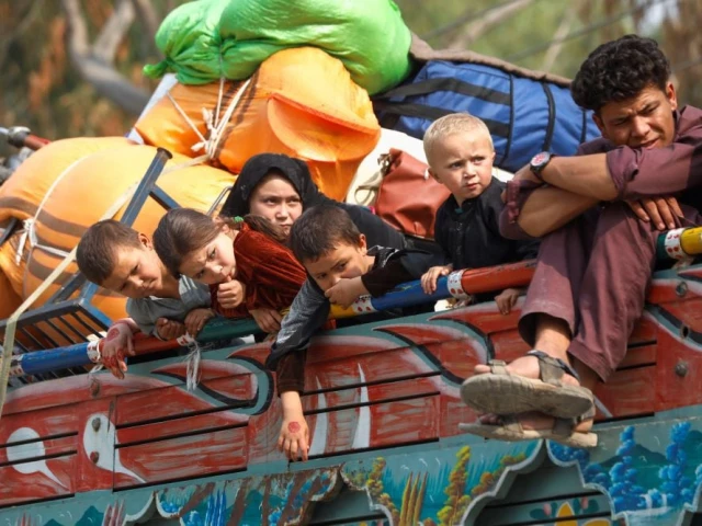 afghan refugee children sit on a truck loaded with belongings as they along with their families prepare to return home after pakistan gives the last warning to undocumented immigrants to leave outside the united nations high commissioner for refugees unhcr repatriation centres in azakhel town in nowshera photo reuters afghan refugee children sit on a truck loaded with belongings as they along with their families prepare to return home after pakistan gives the last warning to undocumented immigrants to leave outside the united nations high commissioner for refugees unhcr repatriation centres in azakhel town in nowshera photo reuters