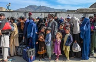 afghan refugees wait in a queue to cross the pakistan afghanistan border in torkham on october 27 2023 photo afp