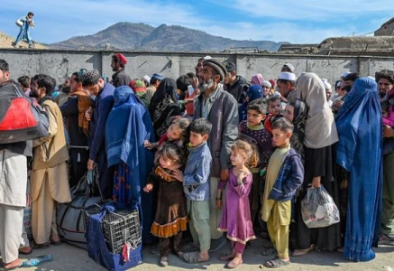 afghan refugees wait in a queue to cross the pakistan afghanistan border in torkham on october 27 2023 photo afp