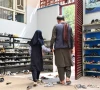 an afghan father collects his daughter from primary school in kabul photo afp an afghan father collects his daughter from primary school in kabul photo afp